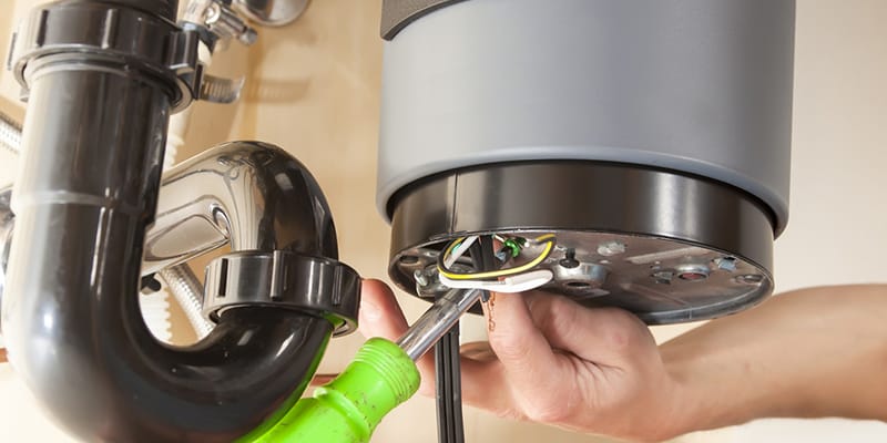 Prescott Valley, Arizona plumber servicing water heater pipe connection