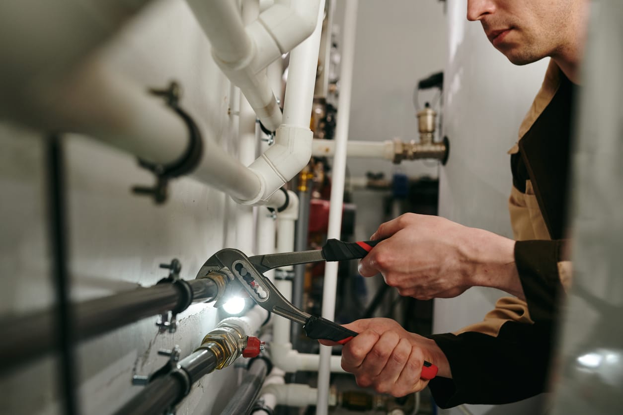 Plumbers maintaining commercial plumbing pipes in Prescott Valley