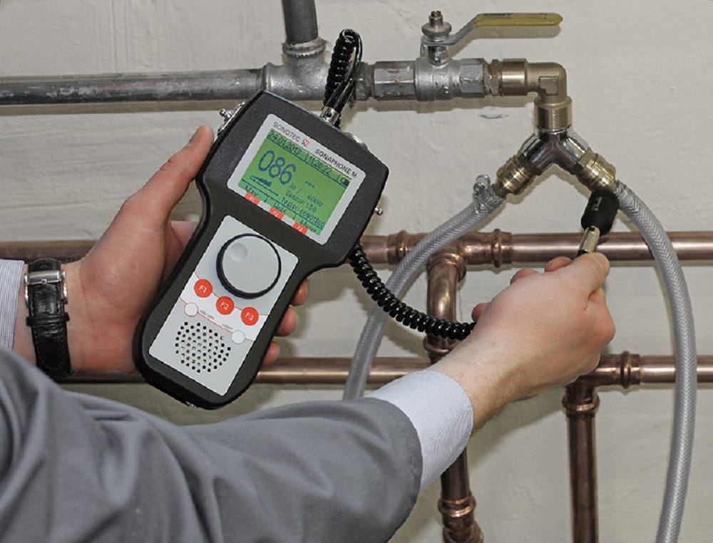 Plumber testing pipes with electronic leak detection equipment in Prescott Valley
