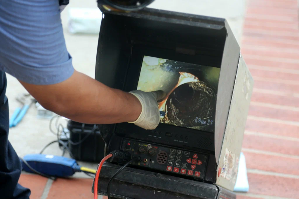 Technician viewing a drain inspection camera in Prescott Valley